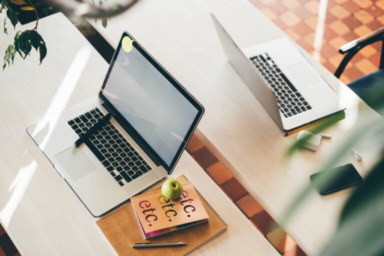 laptop-on-table-in-meeting-room-of-office-workspace